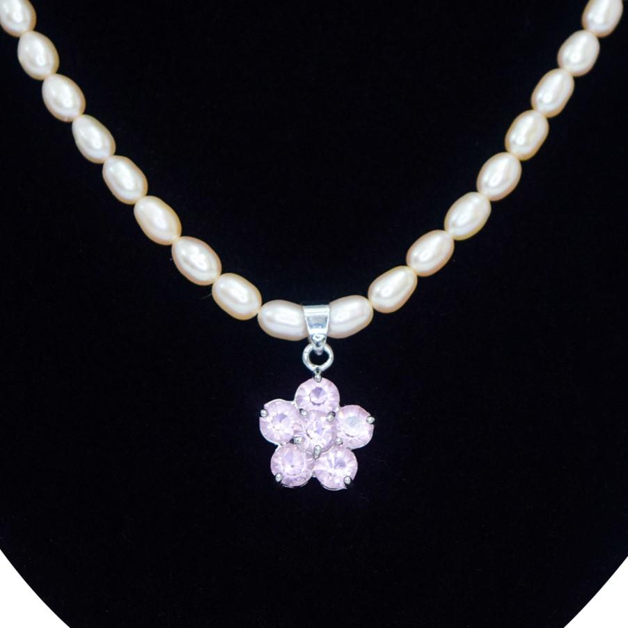 Elegant and cute light pink pearl necklace with flower-shaped pendant studded with pink crystals close up