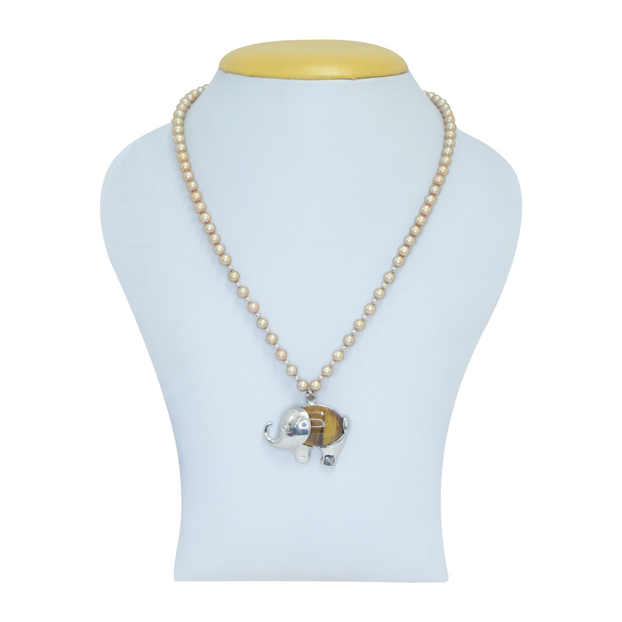 Well crafted round golden pearl necklace set with SP tiger eye elephant pendant