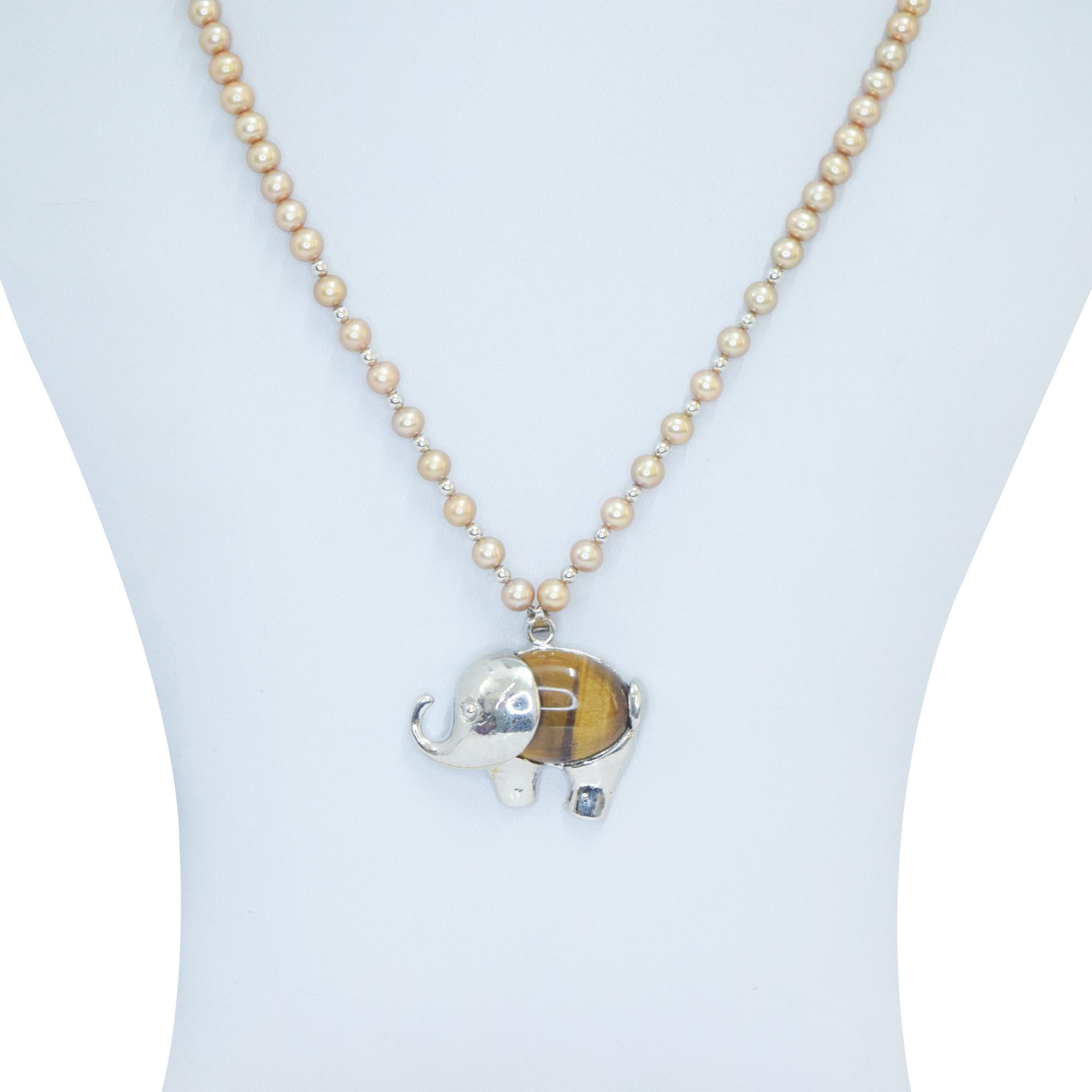 Well crafted round golden pearl necklace set with SP tiger eye elephant pendant - close up