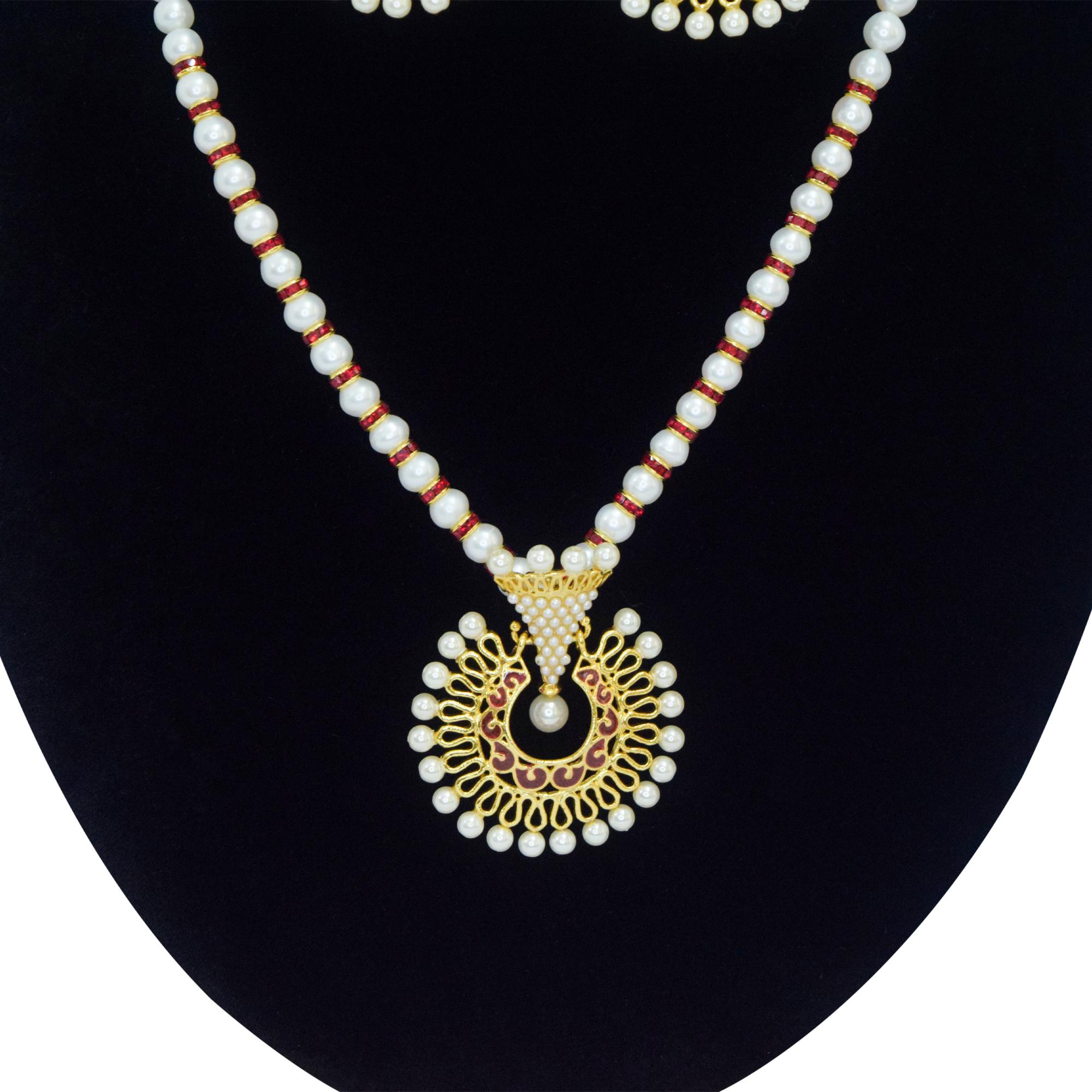 Well crafted white round pearls with SP ruby roundels and a captivating faux pearl pendant with red enamel - close up