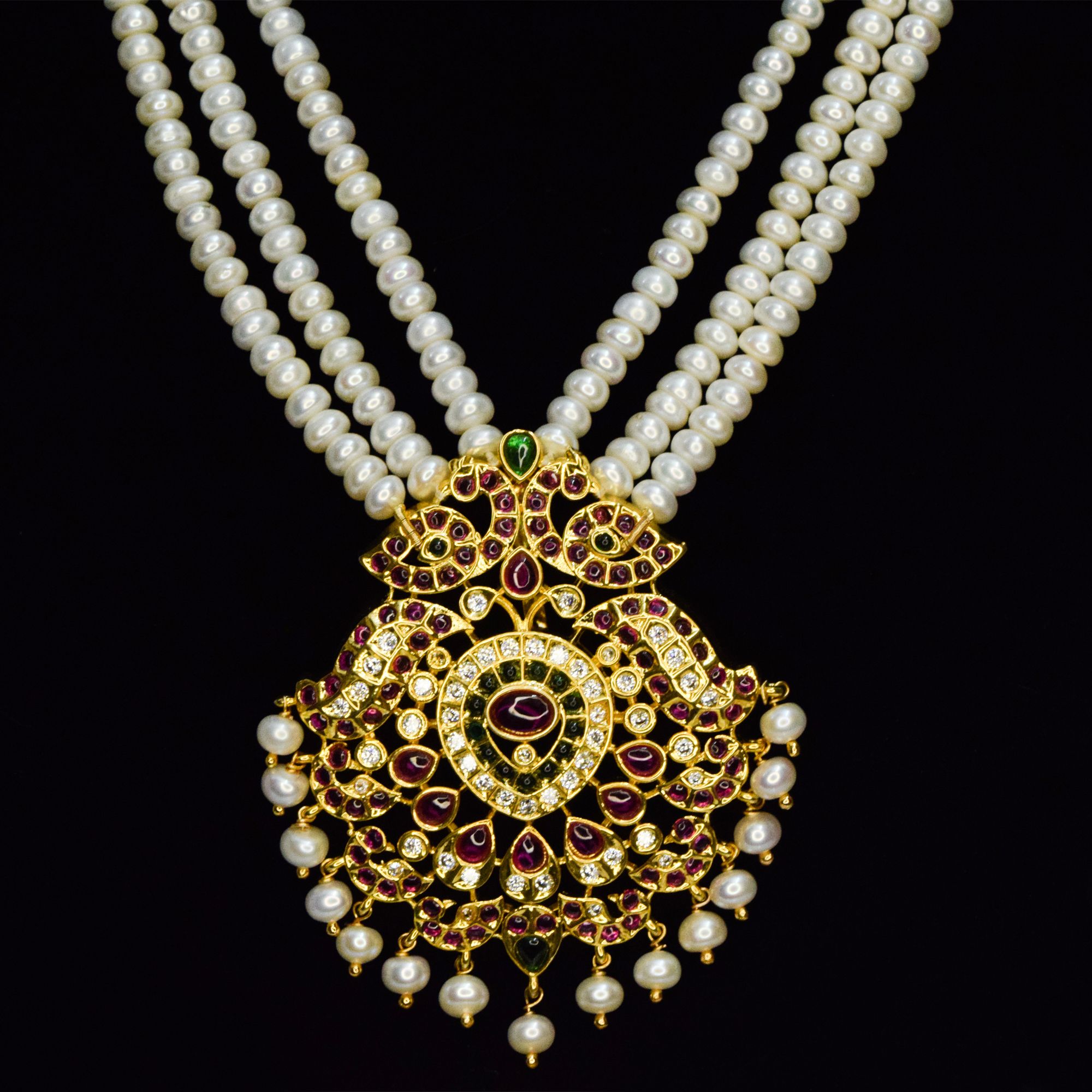 Splendidly crafted triple line white semi-round pearl haar with a grand peacock kemp pendant - pendant
