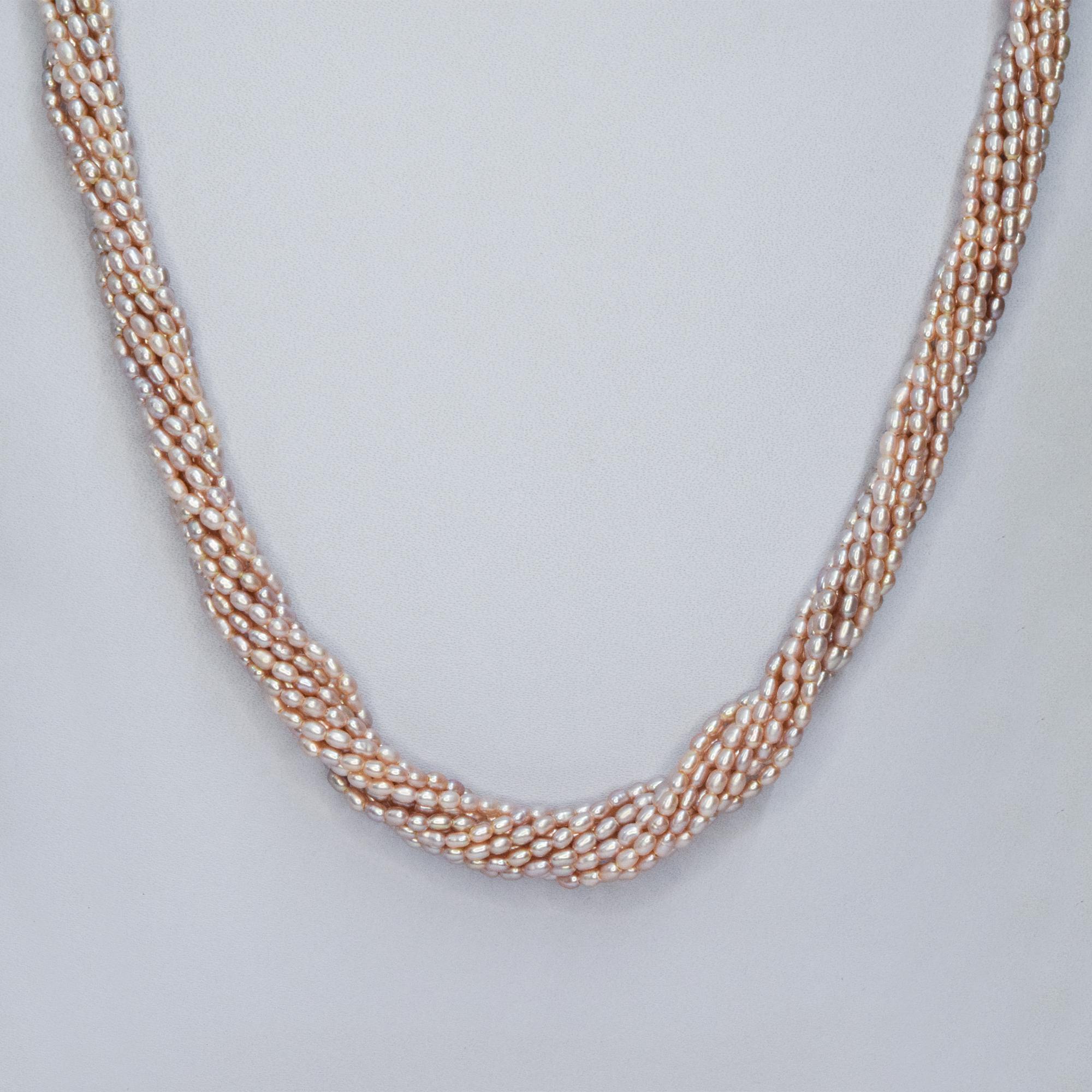 Stunning 15 strands of peach rice pearls finely crafted to a long 20-inch necklace - twisted close up