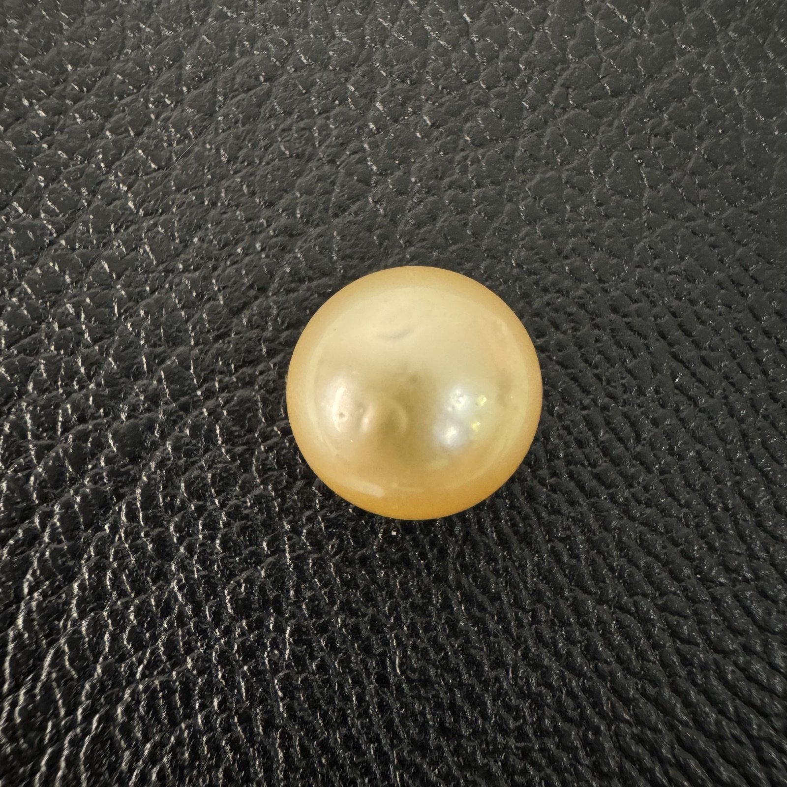 Second view of a 10.7mm golden South Sea loose pearl showing lustre and surface - Pure Pearls