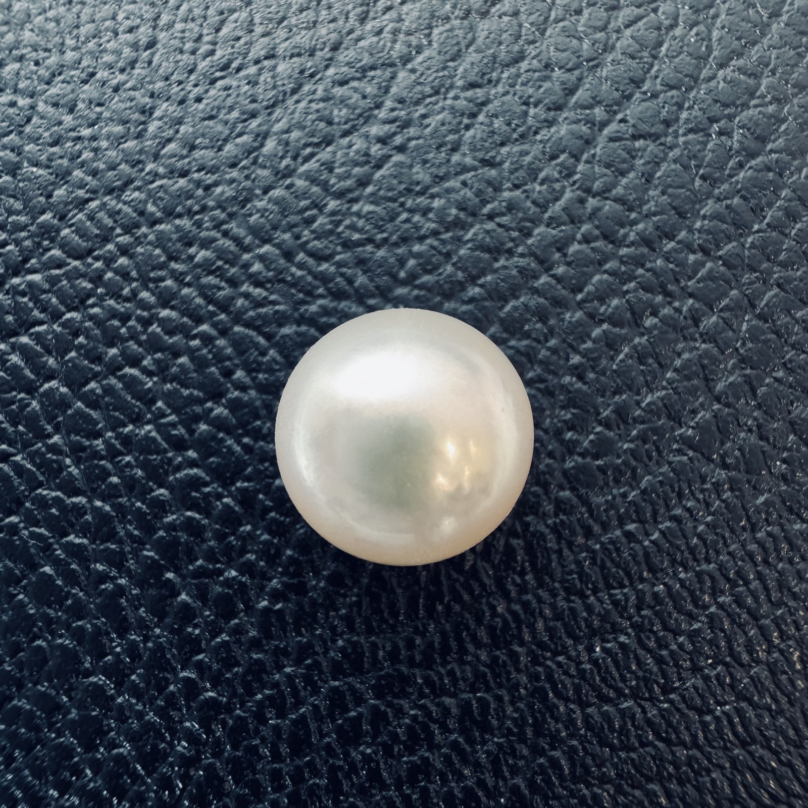 Second view of a 10.4mm white South Sea loose pearl showing lustre and surface - Pure Pearls